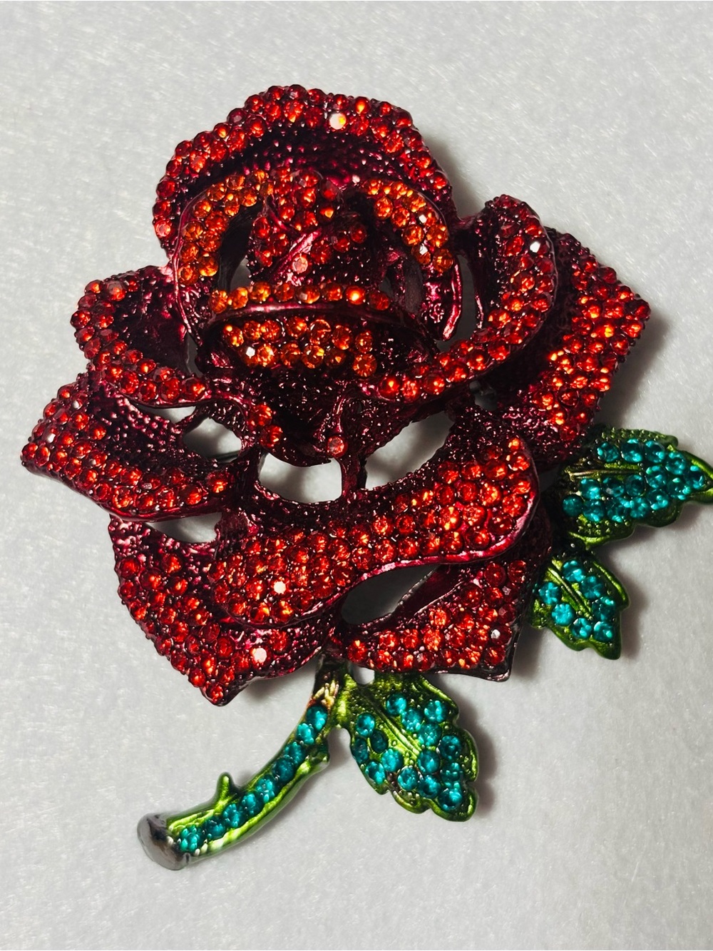 Red Rhinestone Rose Brooch with Green Jeweled Leaves